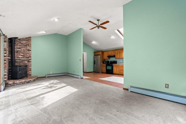 5 Ingalls Rd, Tyngsborough, MA 01879 - unfurnished living room with a baseboard radiator, a ceiling fan, light carpet, a wood stove, and lofted ceiling