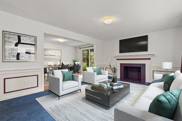 5 Ingalls Rd, Tyngsborough, MA 01879 - living area featuring carpet flooring, a wainscoted wall, and a brick fireplace