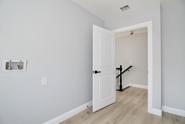 664 Mckinstry Ave, Chicopee, MA 01020 - laundry room with baseboards, light wood finished floors, and washer hookup
