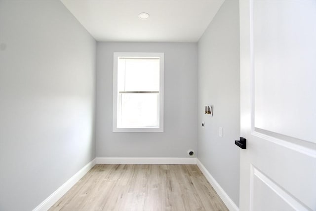 664 Mckinstry Ave, Chicopee, MA 01020 - laundry area with electric dryer hookup, light wood-style floors, and baseboards