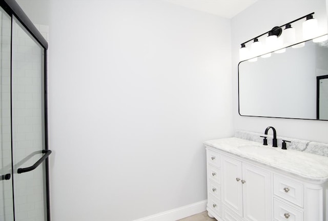 664 Mckinstry Ave, Chicopee, MA 01020 - bathroom with baseboards, tiled shower, and vanity