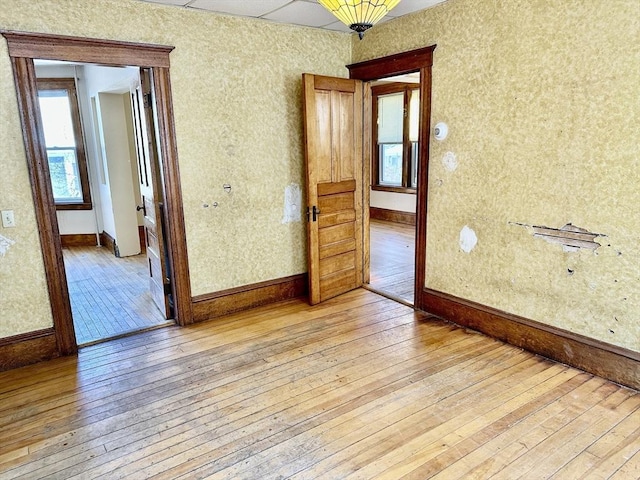 spare room featuring light wood-type flooring