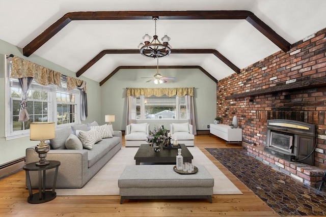 living area with ceiling fan with notable chandelier, wood finished floors, lofted ceiling with beams, and a healthy amount of sunlight