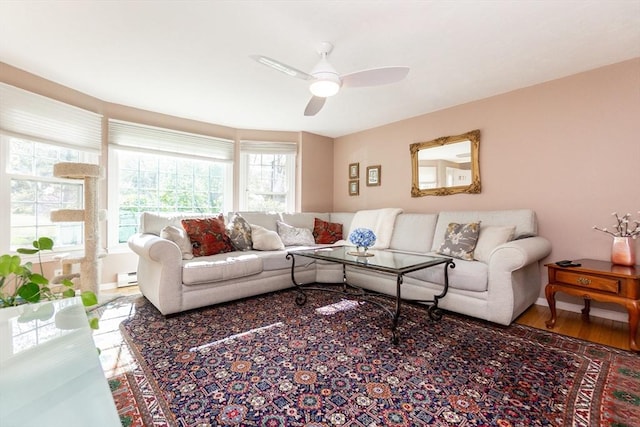 60 Spencer St Unit 60, Millis, MA 02054 - living room with healthy amount of natural light, a ceiling fan, a baseboard radiator, and baseboards
