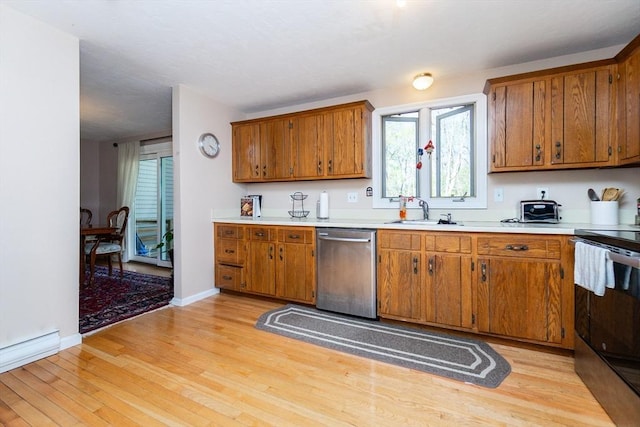 60 Spencer St Unit 60, Millis, MA 02054 - kitchen with stainless steel dishwasher, electric range, a sink, light wood-type flooring, and brown cabinets