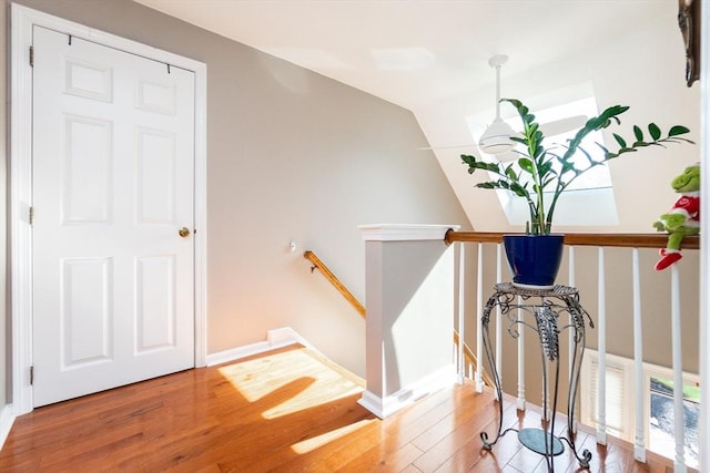 60 Spencer St Unit 60, Millis, MA 02054 - stairs with wood finished floors, vaulted ceiling, and baseboards