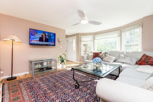 60 Spencer St Unit 60, Millis, MA 02054 - living area featuring baseboards, wood finished floors, and ceiling fan
