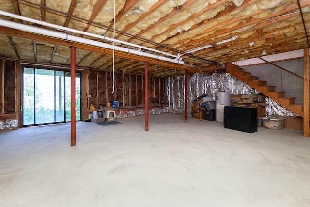 60 Spencer St Unit 60, Millis, MA 02054 - below grade area featuring water heater and stairway