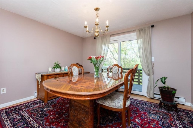 60 Spencer St Unit 60, Millis, MA 02054 - dining room featuring a chandelier, baseboards, light wood-style floors, and a baseboard heating unit