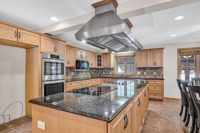 kitchen with tasteful backsplash, a center island, light tile floors, island range hood, and black appliances