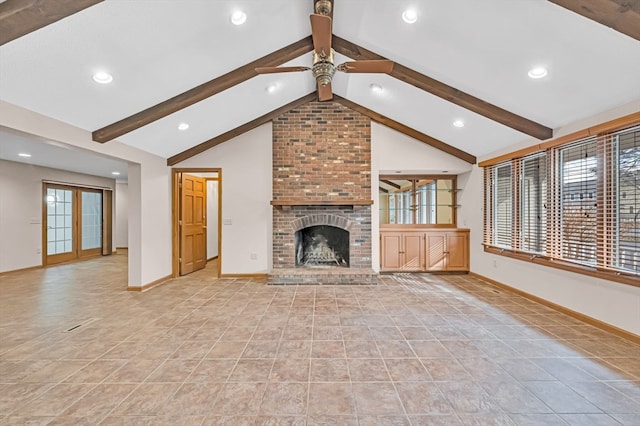 unfurnished living room featuring ceiling fan, brick wall, a fireplace, and light tile floors