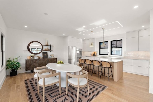 20 Clinton St Unit 22, Newton, MA 02458 - dining area with light wood-type flooring and recessed lighting