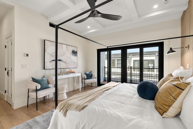 20 Clinton St Unit 22, Newton, MA 02458 - bedroom with coffered ceiling, light wood-style floors, access to exterior, beam ceiling, and recessed lighting