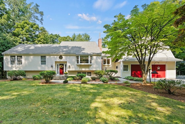 raised ranch featuring a front yard