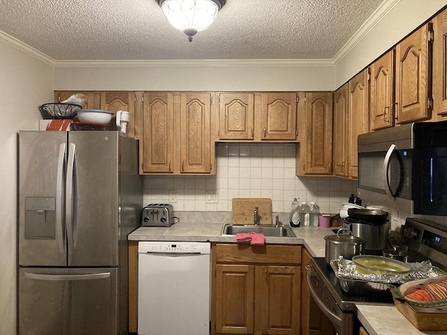 2 Summit Unit 68, Reading, MA 01867 - kitchen with stainless steel appliances, light countertops, a textured ceiling, backsplash, and ornamental molding