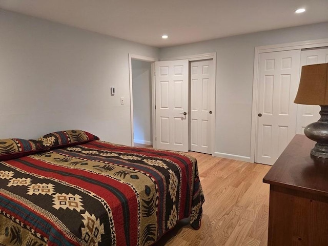 432 Old Chatham Rd Unit 504, Dennis, MA 02660 - bedroom featuring light wood-style floors, two closets, and recessed lighting