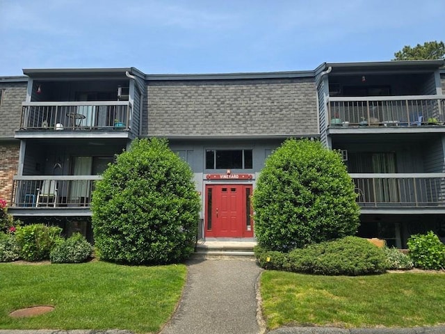 432 Old Chatham Rd Unit 504, Dennis, MA 02660 - view of front of home with a balcony, a shingled roof, and mansard roof