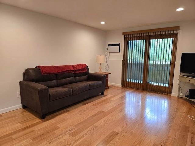 432 Old Chatham Rd Unit 504, Dennis, MA 02660 - living area featuring light wood-type flooring, recessed lighting, and an AC wall unit