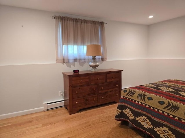 432 Old Chatham Rd Unit 504, Dennis, MA 02660 - bedroom featuring a baseboard heating unit, light wood-style flooring, and recessed lighting