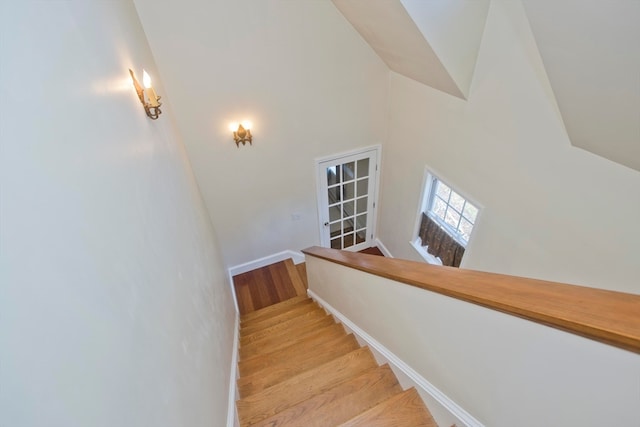 stairway with hardwood / wood-style floors