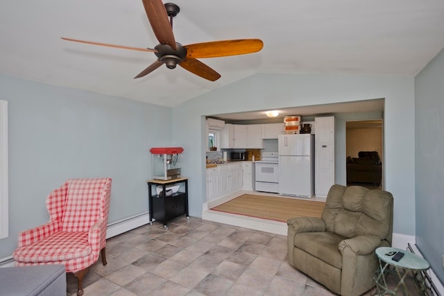 living area featuring sink, vaulted ceiling, ceiling fan, and a baseboard heating unit