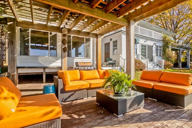 exterior space featuring a grill, a wooden deck, and an outdoor living space