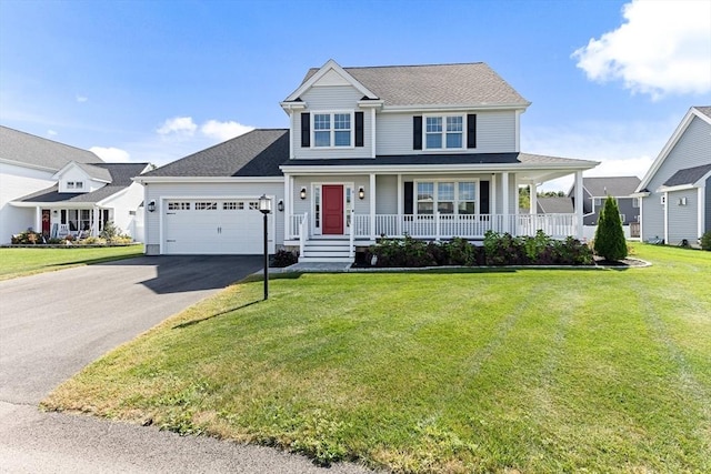 view of front of home featuring covered porch, a front lawn, an attached garage, and aphalt driveway