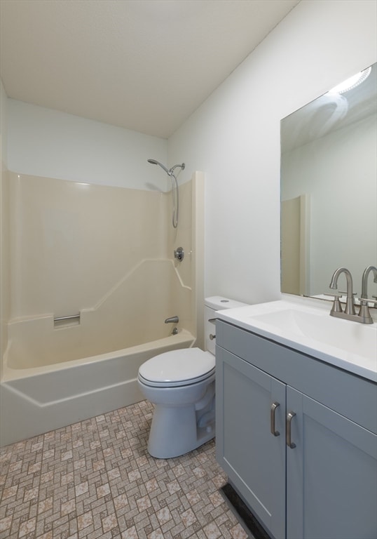 full bathroom with vanity, bathtub / shower combination, and toilet