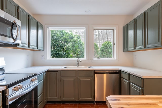 kitchen featuring stainless steel appliances and sink