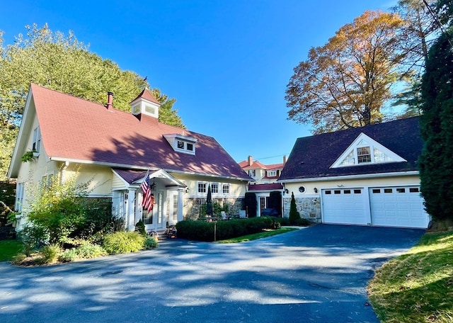 view of front of property featuring a garage