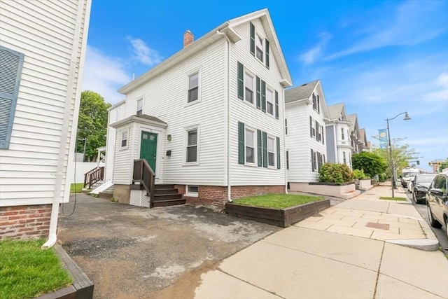 16 Rantoul St, Beverly, MA 01915 - view of front of property with a chimney and a residential view
