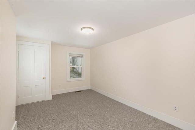 16 Rantoul St, Beverly, MA 01915 - carpeted empty room featuring baseboards