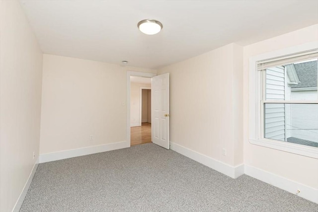 16 Rantoul St, Beverly, MA 01915 - spare room featuring carpet and baseboards