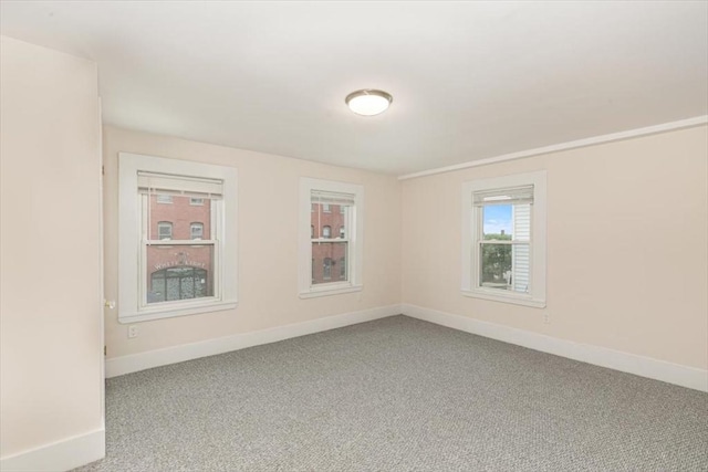 16 Rantoul St, Beverly, MA 01915 - spare room with baseboards and carpet flooring