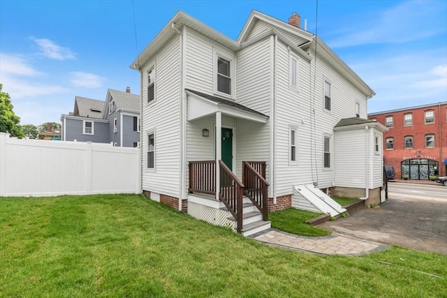 16 Rantoul St, Beverly, MA 01915 - rear view of house featuring a chimney