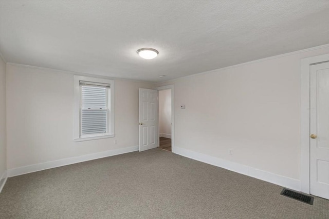16 Rantoul St, Beverly, MA 01915 - spare room with carpet floors, crown molding, and a textured ceiling