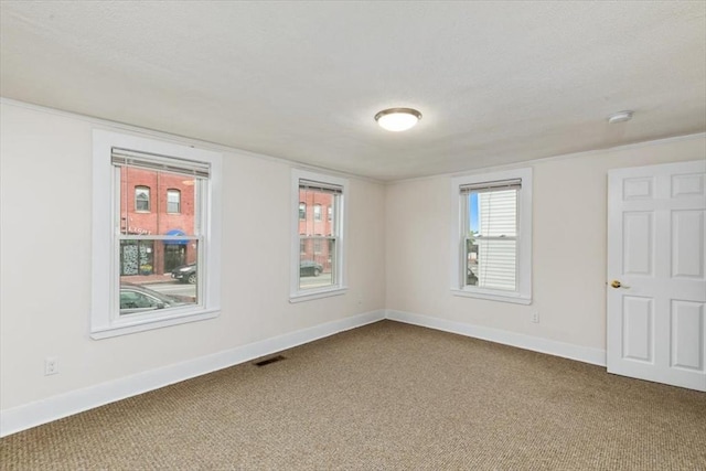 16 Rantoul St, Beverly, MA 01915 - carpeted empty room with baseboards and a smoke detector