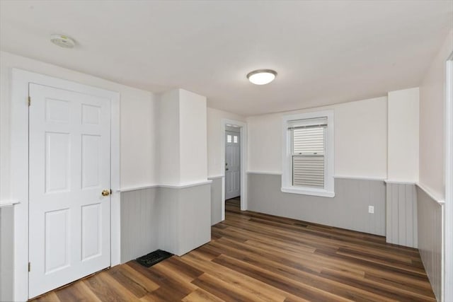16 Rantoul St, Beverly, MA 01915 - unfurnished room with wood finished floors, wainscoting, and a smoke detector