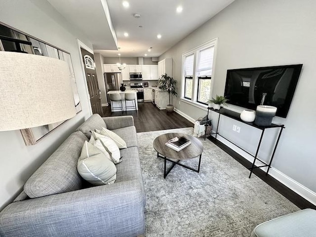 64 Clarkwood Unit 2, Boston, MA 02126 - living area with dark wood finished floors, recessed lighting, and a chandelier