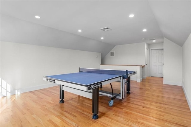 playroom with light wood-style floors, lofted ceiling, and baseboards