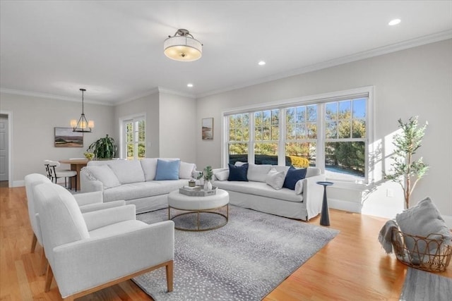 living room with recessed lighting, a wealth of natural light, and light wood-style floors