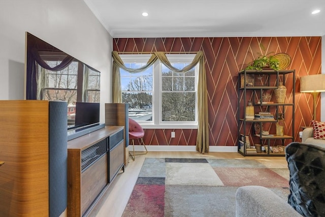 living room with recessed lighting, baseboards, and crown molding