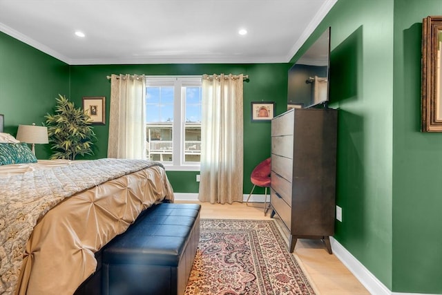 bedroom featuring recessed lighting, baseboards, crown molding, and light wood-style floors