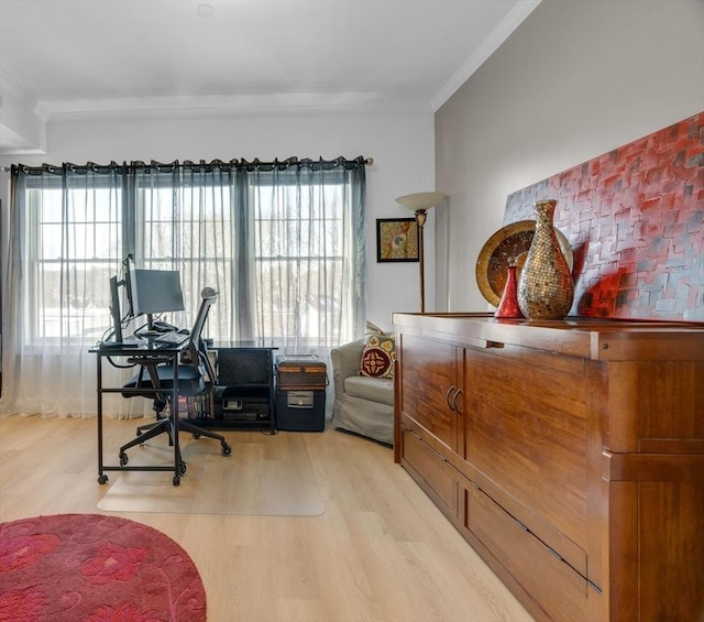 office area with light wood-style flooring and ornamental molding