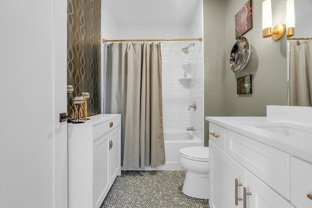 full bathroom with tile patterned floors, shower / bath combo with shower curtain, toilet, and vanity