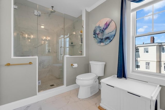 full bath featuring baseboards, a marble finish shower, ornamental molding, toilet, and marble finish floor