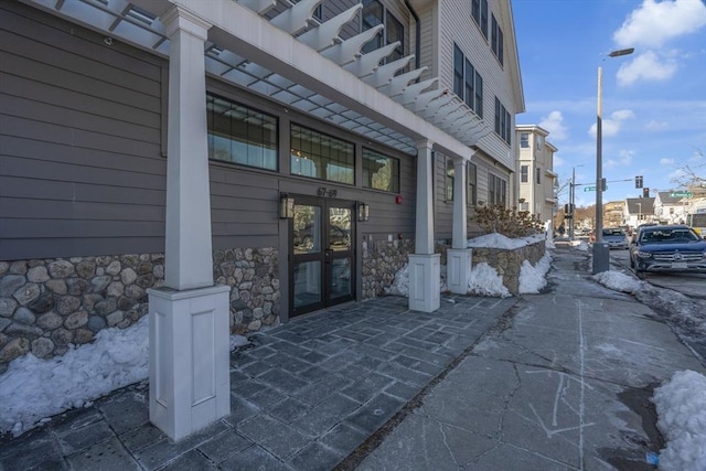 entrance to property with stone siding