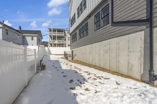 view of side of home with a fenced backyard