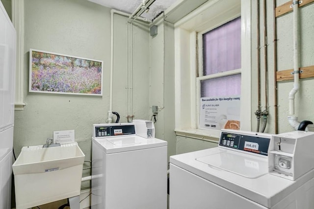 laundry room featuring washer and dryer and sink