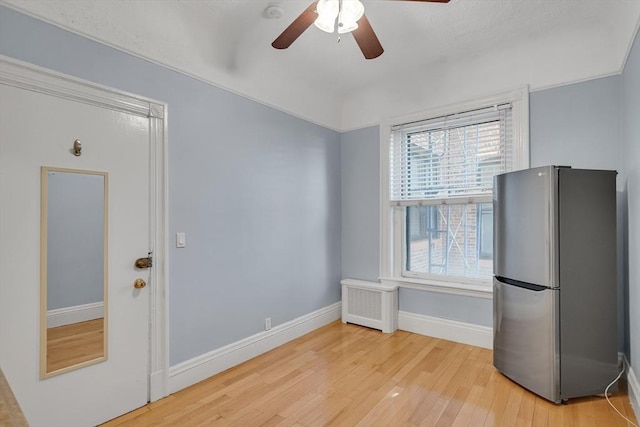 interior space featuring ceiling fan and wood-type flooring